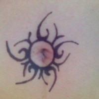 Stomach tattoo, black circle like sun around the navel