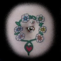Stomach tattoo. circle of flowers and heart