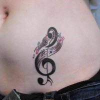 Stomach tattoo, designed, black treble clef, melodies
