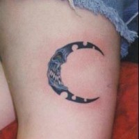 Evil moon crescent tattoo on leg