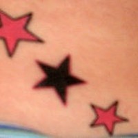 Pink and black stars tattoo
