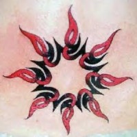 Red and black tribal sun tattoo