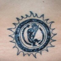Black ink tribal sun tattoo
