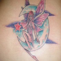 Colourful fairy on moon tattoo