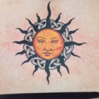 Sun with knotted tracery tattoo