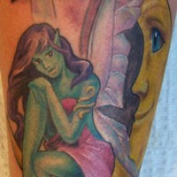 Green fairy on moon crescent tattoo