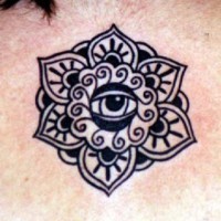 Eye in flower symbol tattoo