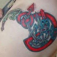Red snake with tribal tracery tattoo