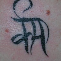 Black ink hindu symbol tattoo