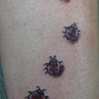Red ladybugs caravan tattoo