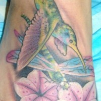 Tattoo of hummingbird and dragonfly