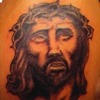 Tattoo of jesus in crown of thornes