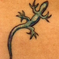 Small tattoo of blue lizard