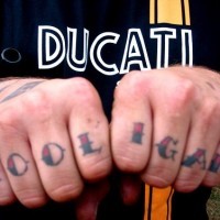 Tattoo on knuckles, hooligan, colourful styled