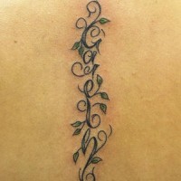 Text and vine tattoo on the spine