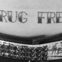 Text stomach tattoo, drug free, black and white inscription
