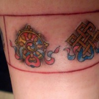 Tibetian symbols armbend coloured tattoo