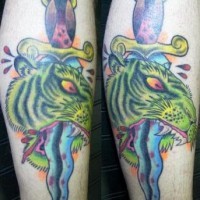 Dead tiger with dagger tattoo