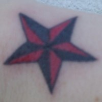 Tiny red and black star tattoo