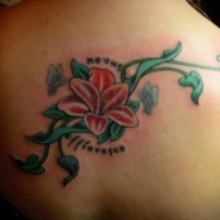 Back tree tattoo with big red flower