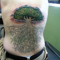 Back tattoo of tree with green leaves and big root