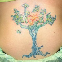Big tree tattoo with red character in leafage