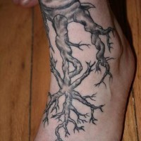 Black foot tattoo of tree roots