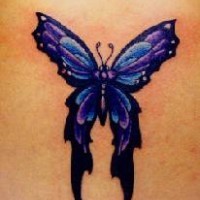 Purple tribal style butterfly tattoo
