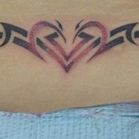 Lower back tattoo,styled  tribal heart