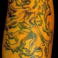 Golden rampant lion tattoo