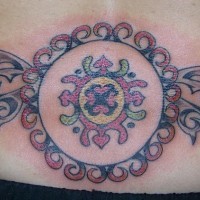 Tribal lower back tattoo, round pattern, decorated, colourful