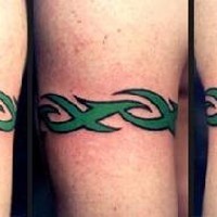 Green tribal bracelet tattoo