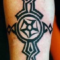 Black tribal tattoo with symbol in the circle