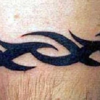 Tribal bracelet tattoo in black ink
