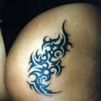 Black tribal sign tattoo on buttock