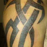 Tribal shoulder tattoo, black, braided pattern