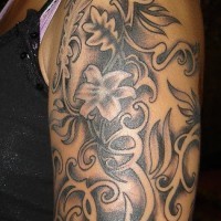 Black flower tracery sleeve tattoo