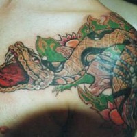 Super realistic snake tattoo on shoulder