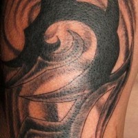 Tribal sign tattoo in black ink