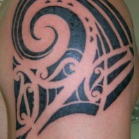 Black tribal tattoo with big wave