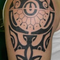 Black tribal tattoo on shoulder