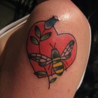 Bee and flower in red heart tattoo