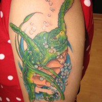 Green turtle swimming in the ocean on tattoo