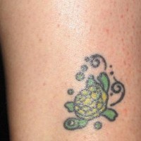 Happy small green turtle tattoo