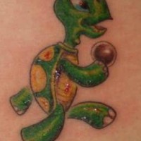 Colored tattoo of walking turtle with ball