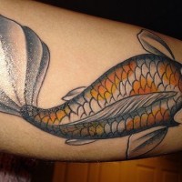 Gold fish upper arm tattoo