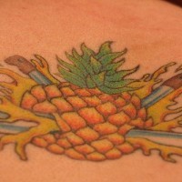 On upper back pine-apple tattoo  punctured with knives