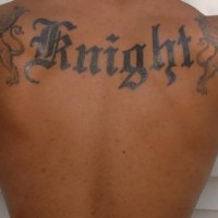 Knight styled tattoo inscription on upper back