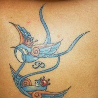 Flying swallows tattoo on upper back with crowns