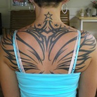 Wide wings on upper back tattoo with stars
